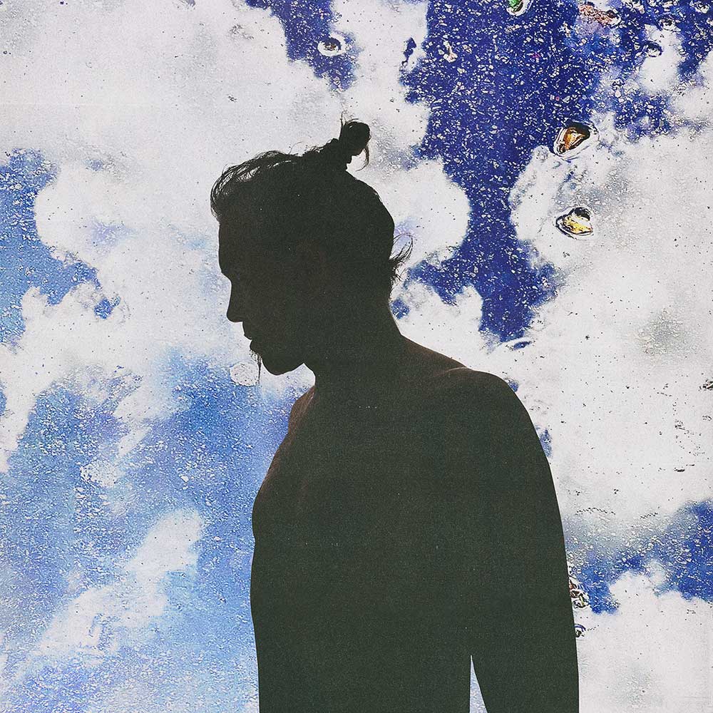 Piero Pelù, copertina dell'album "Deserti" con cielo, nuvole e la sagoma di Piero Pelù in ombra